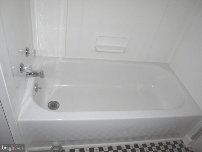 6431 Blenheim Road Baltimore, MD 21212 - Photo 12 of 12 a bathroom with a bathtub
