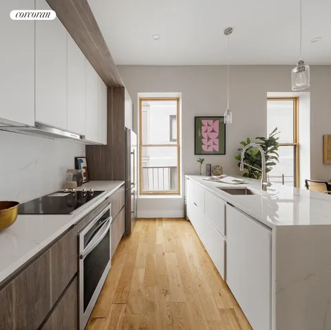 a kitchen with a sink stove and cabinets
