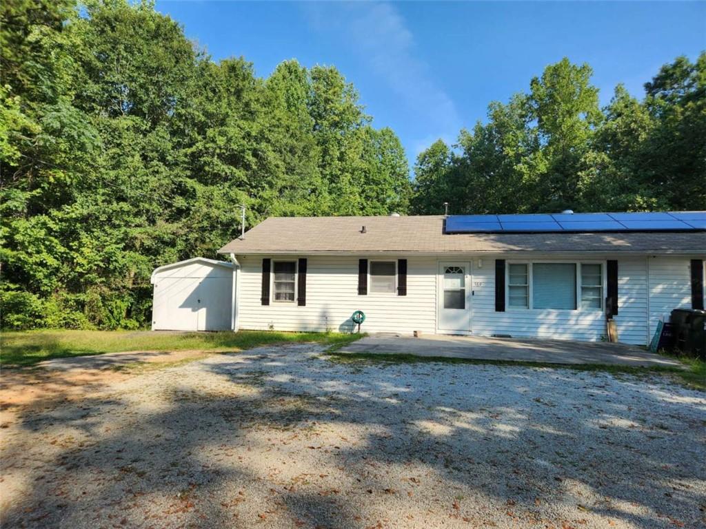 389 Collins Road Toccoa, GA 30577 - Photo 1 of 15 a front view of a house with a yard
