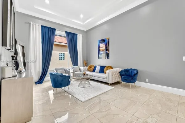 a living room with furniture and a window