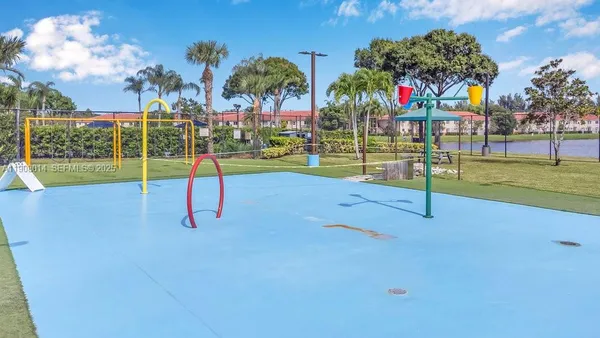a view of a park with swings and slides