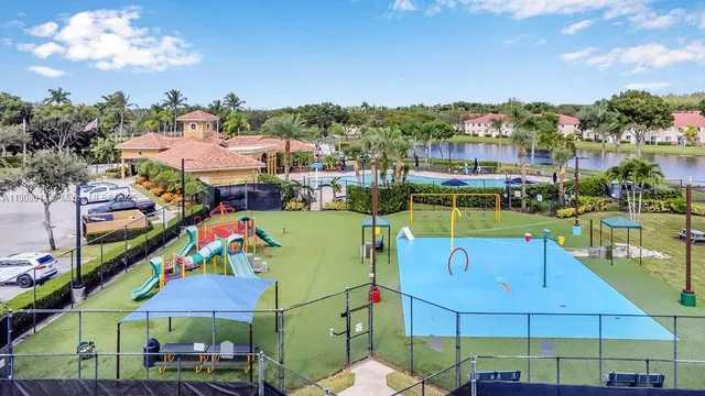 a view of a swimming pool and a chairs