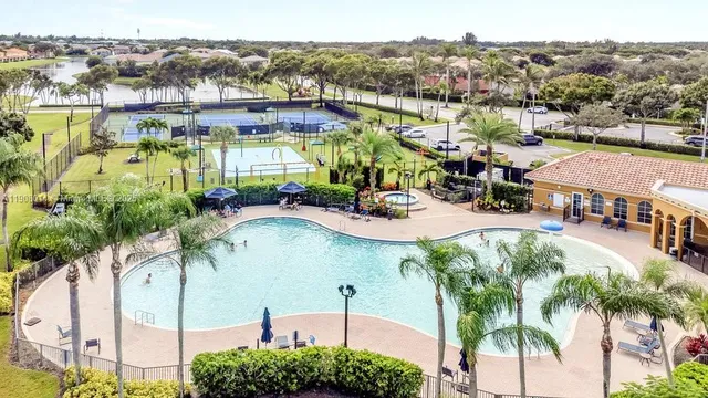 an aerial view of residential houses with outdoor space and river
