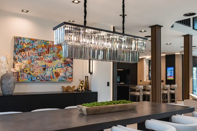 a view of a dining room with furniture large windows and wooden floor
