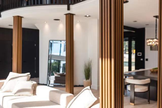 a kitchen with stainless steel appliances kitchen island granite countertop a refrigerator and a sink