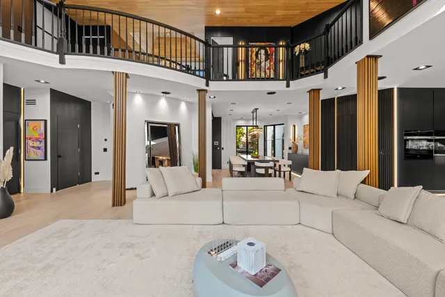 a spacious bedroom with a bed and a fireplace