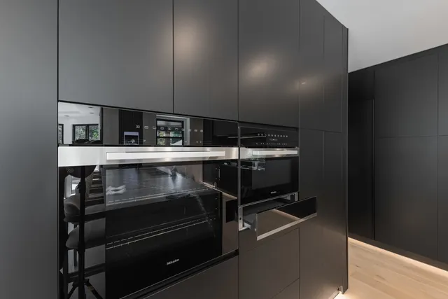 a bedroom with a bed and a television