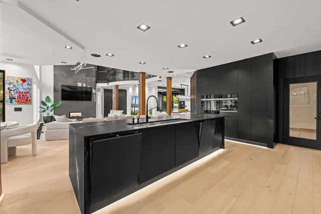 a view of a livingroom with furniture and a ceiling fan