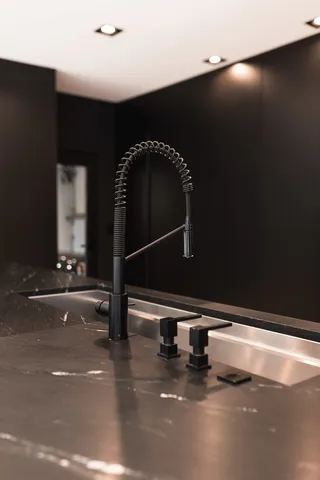 a swimming pool view with a seating space and a garden view