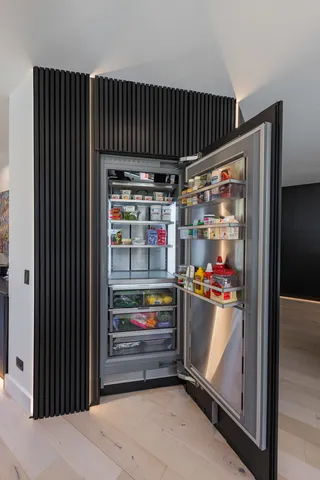 an aerial view of a residential houses with outdoor space