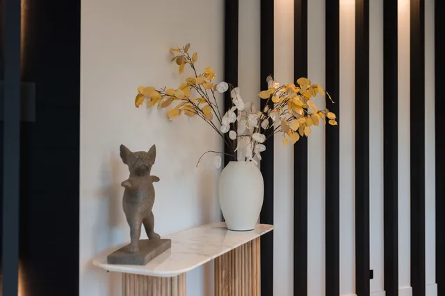 a view of a patio with couches table and chairs and potted plants