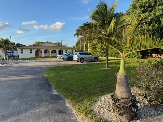 a view of a chandelier fan in a room