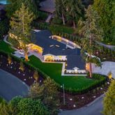 an aerial view of house with a yard