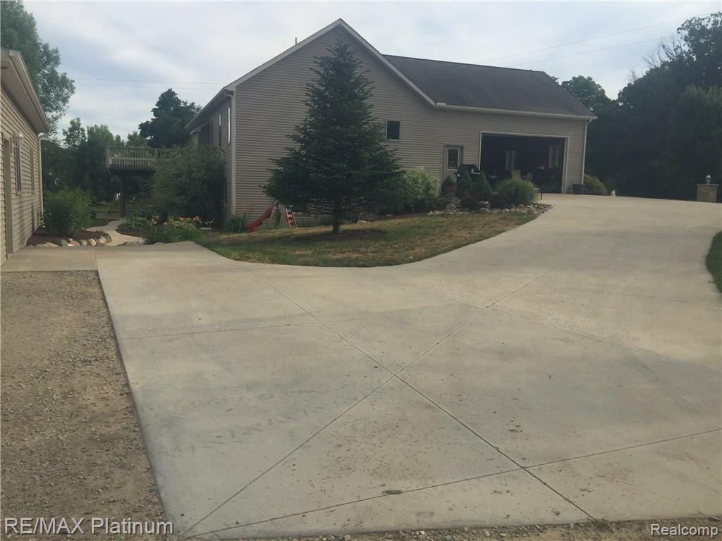 11661 Roberts Road Stockbridge, MI 49285 - Photo 44 of 53 Concrete-Extensive Approaches and Pads. $18k