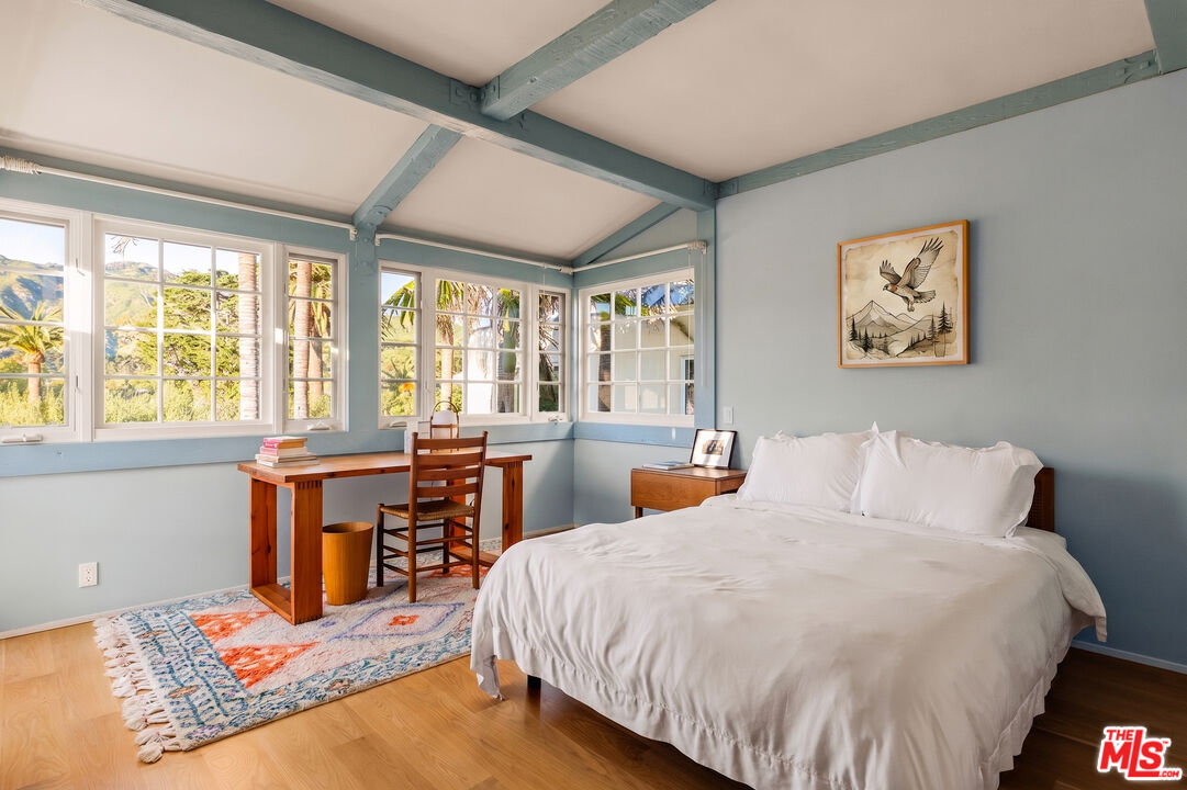 23422 Malibu Colony Road, Unit 98 Malibu, CA 90265 - Photo 12 of 42 a bed sitting in a bedroom next to a window