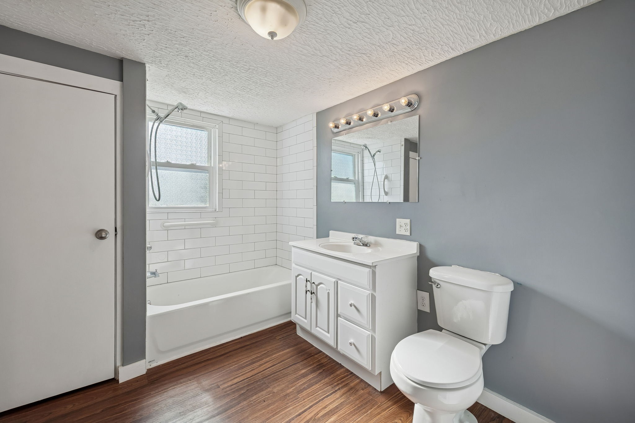 2554 Bakerton Road Red Boiling Springs, TN 37150 - Photo 18 of 46 a bathroom with a toilet a sink and mirror
