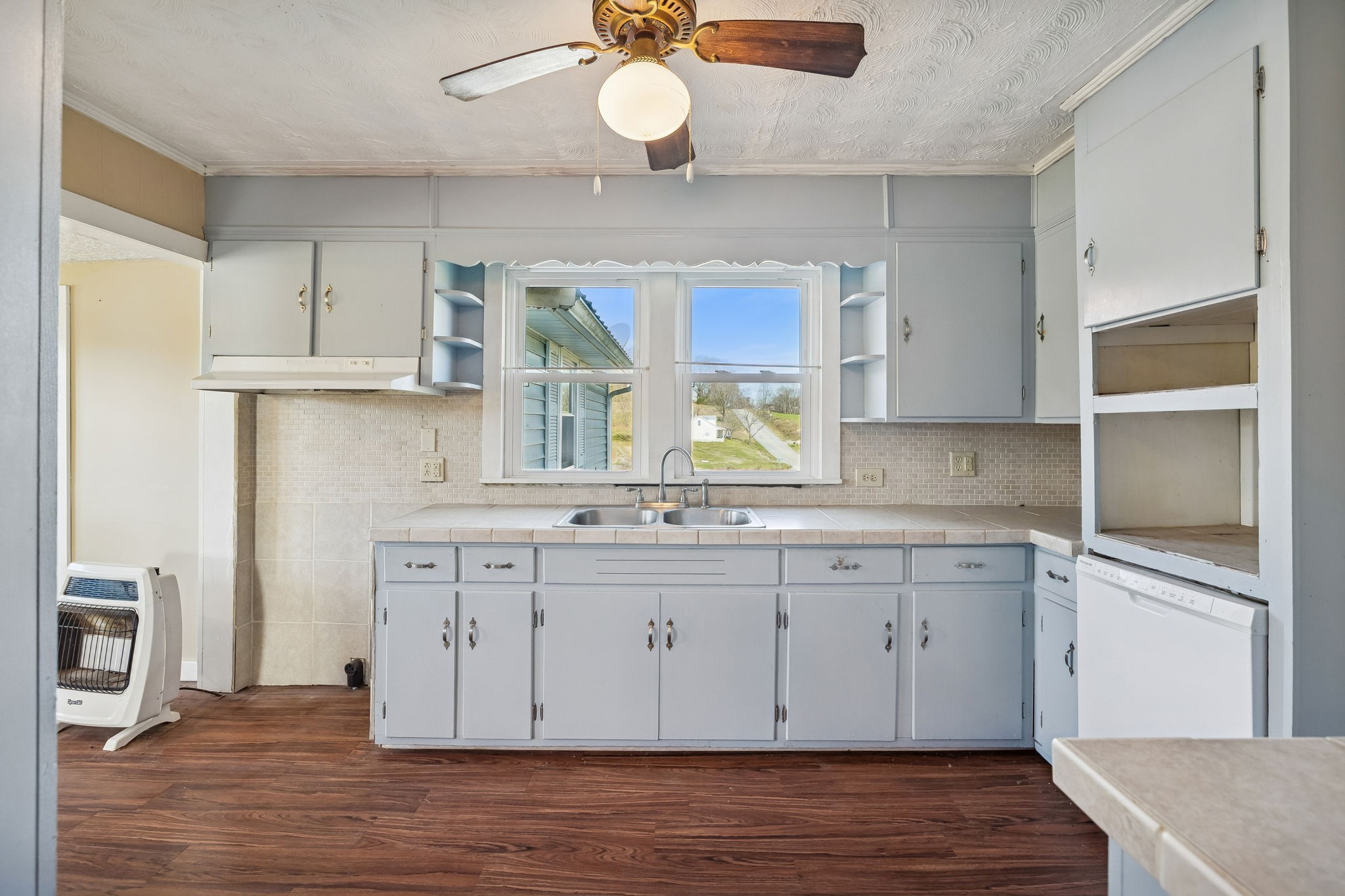 2554 Bakerton Road Red Boiling Springs, TN 37150 - Photo 22 of 46 a kitchen with stainless steel appliances granite countertop a sink window and cabinets