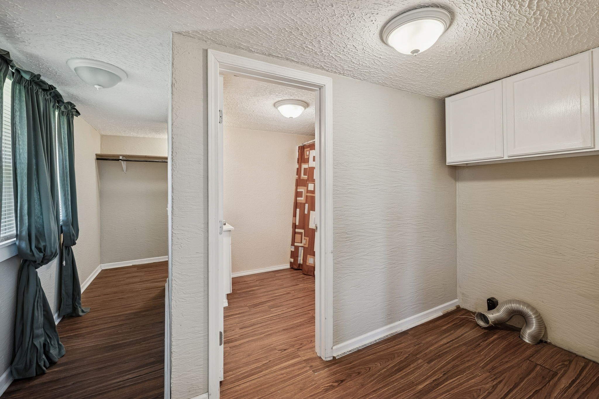 2554 Bakerton Road Red Boiling Springs, TN 37150 - Photo 28 of 46 a view of a hallway with wooden floor and closet