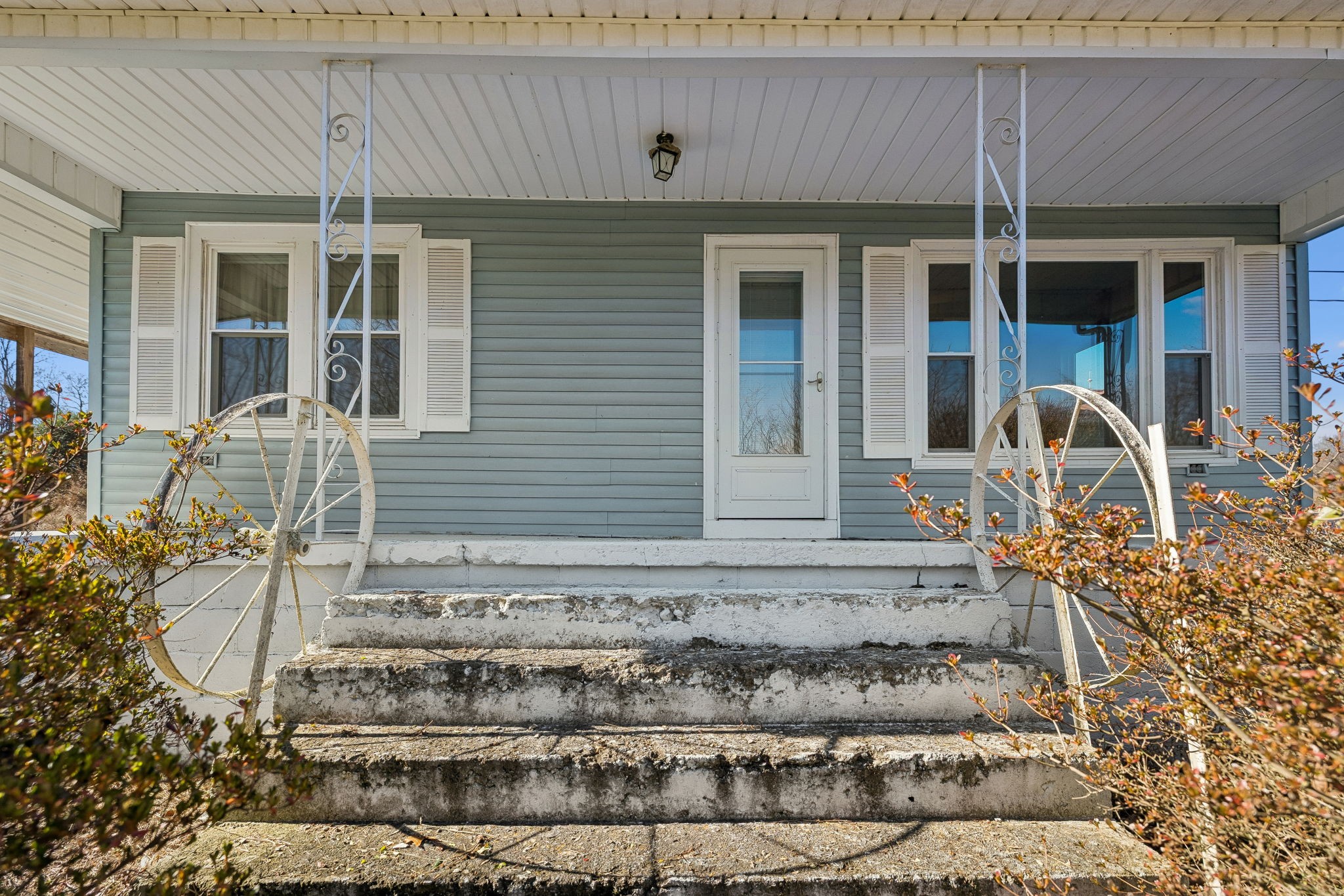 2554 Bakerton Road Red Boiling Springs, TN 37150 - Photo 3 of 46 front view of a house with a bench