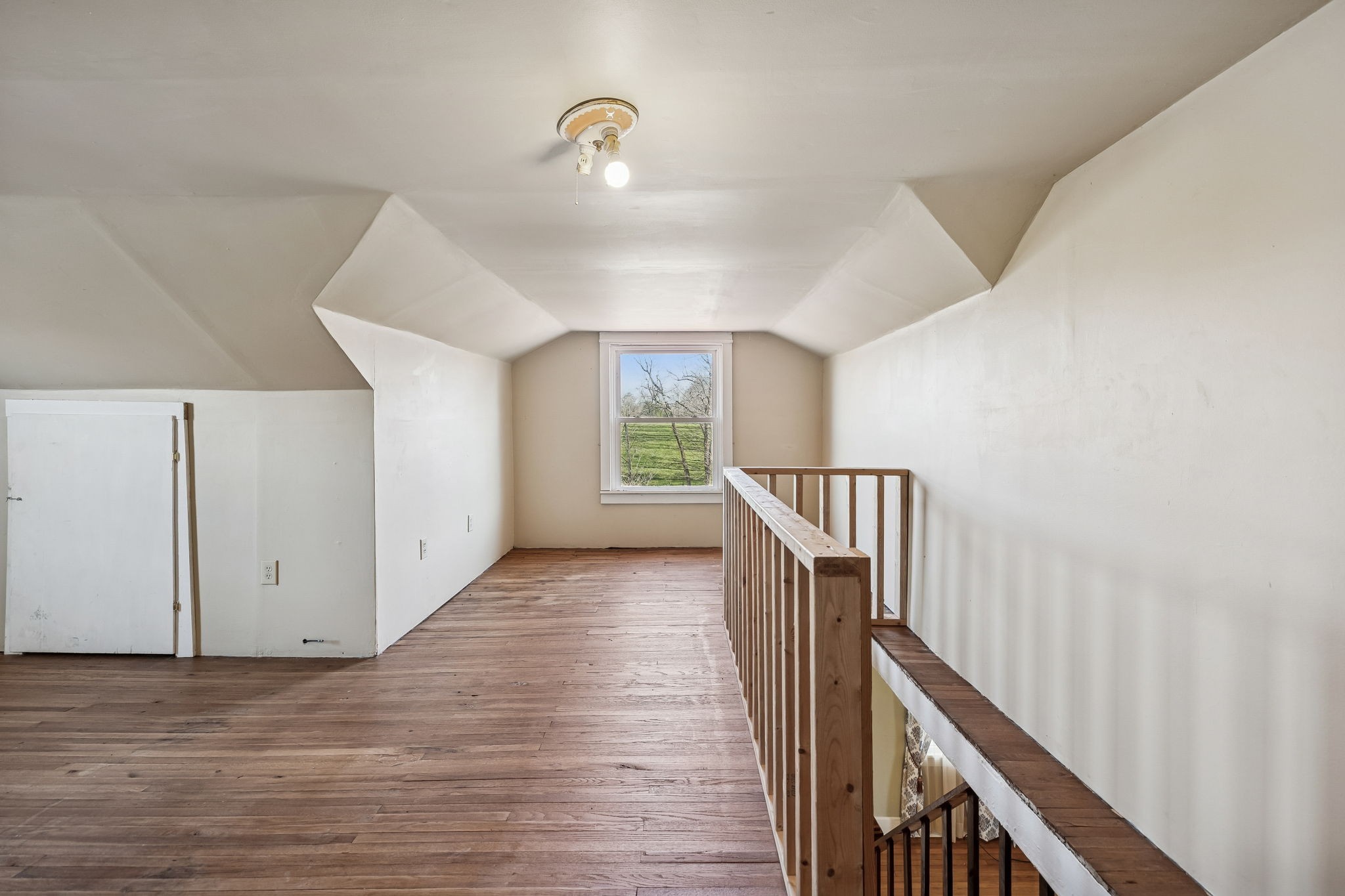 2554 Bakerton Road Red Boiling Springs, TN 37150 - Photo 37 of 46 a view of a hallway with wooden floor and staircase