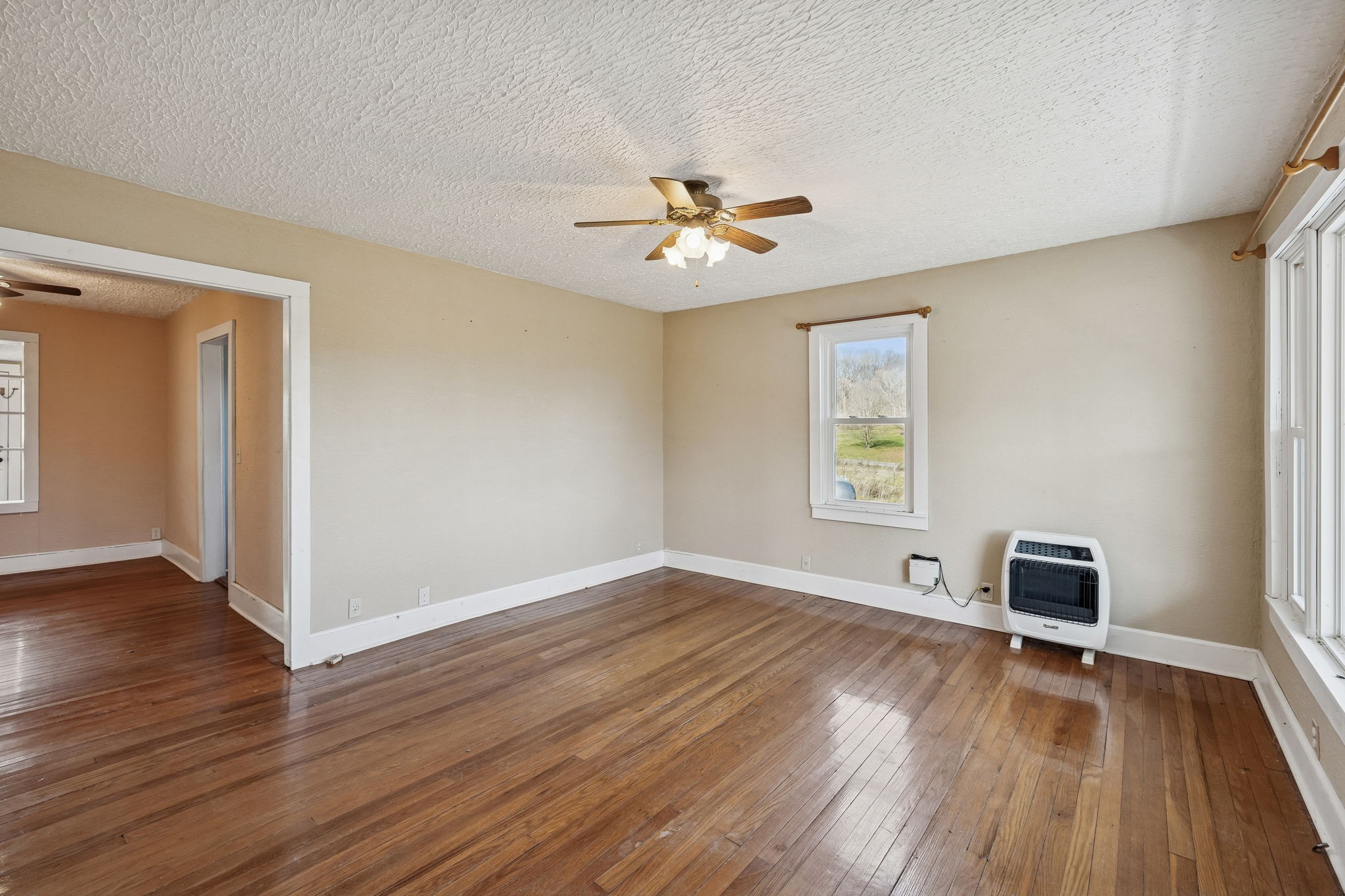 2554 Bakerton Road Red Boiling Springs, TN 37150 - Photo 8 of 46 wooden floor in an empty room with a window
