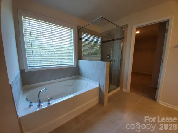a bathroom with a tub and a sink