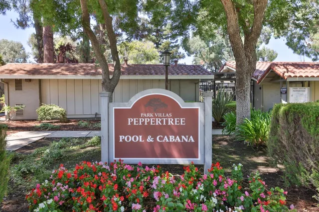 a view of a house with a flower garden