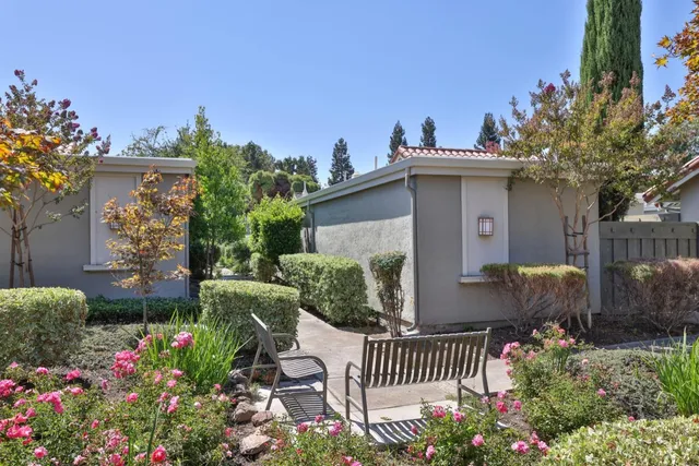 a sign board with yard in the back