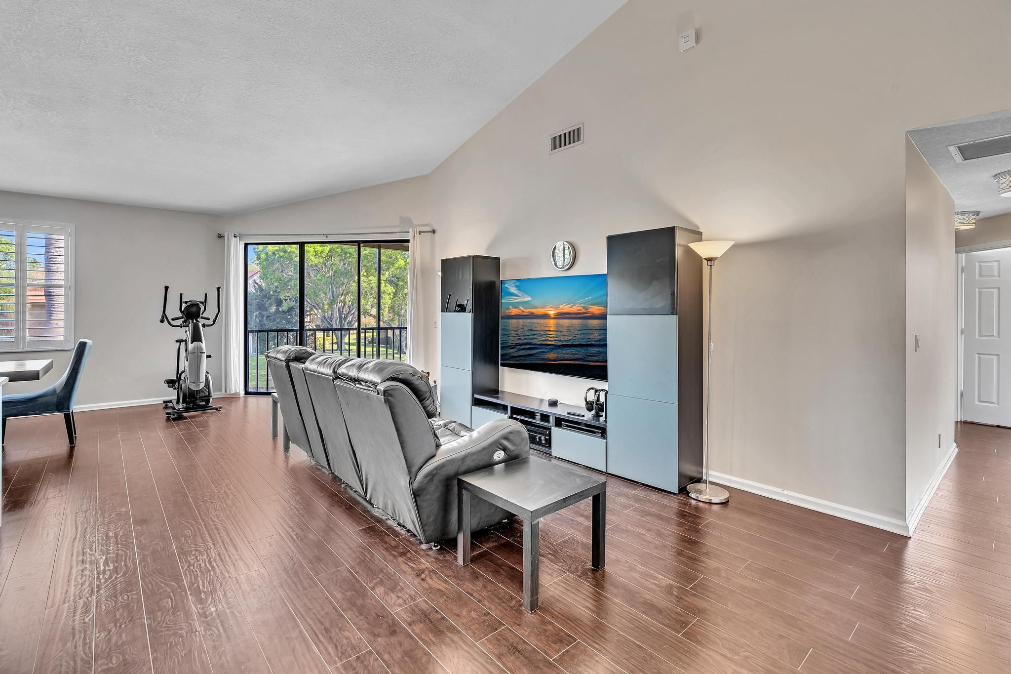 5791 Coach House Circle, Unit H Boca Raton, FL 33486 - Photo 8 of 39 Living room and entry to balcony