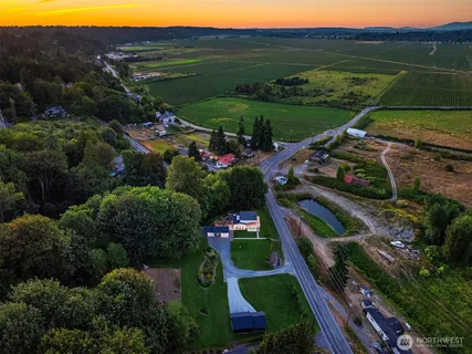 an aerial view of a house with mountain view