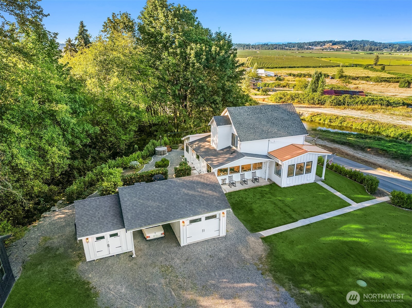 6514 East Lowell Larimer Road Snohomish, WA 98296 - Photo 36 of 40 an aerial view of a house with outdoor space patio and ocean view
