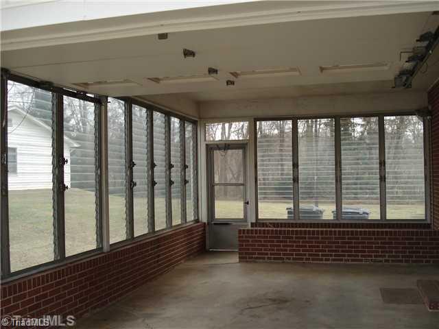 110 Oak Summit Road Winston-Salem, NC 27105 - Photo 14 of 16 Other. Enclosed carport and stairs to full unfinished basement