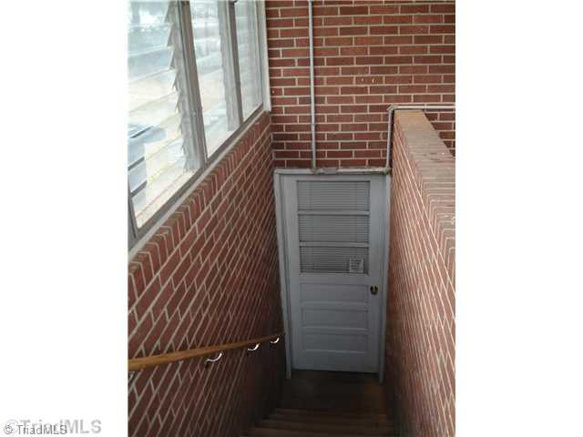 110 Oak Summit Road Winston-Salem, NC 27105 - Photo 15 of 16 Other. Entry to full unfinished basement with masonry fireplace and laundry connections