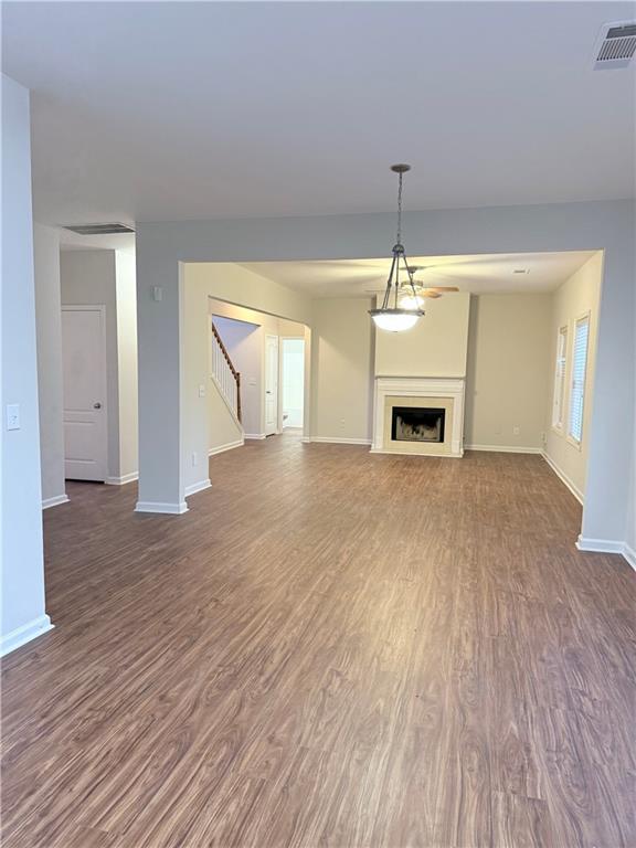82 Kennedy Court Hiram, GA 30141 - Photo 13 of 26 wooden floor fireplace and natural light in room