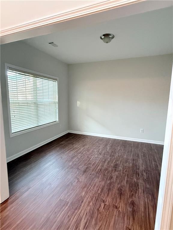 82 Kennedy Court Hiram, GA 30141 - Photo 3 of 26 an empty room with wooden floor and windows