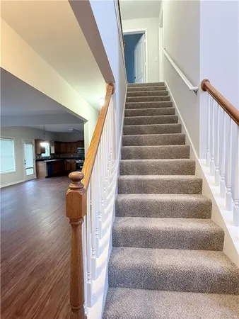 a view of an entryway with wooden floor