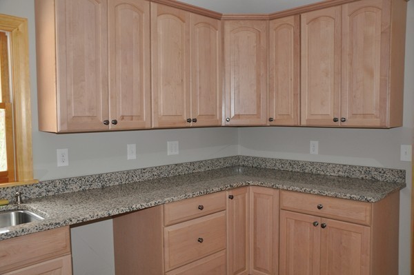 204 Fitchburg Road Townsend, MA 01469 - Photo 18 of 29 a kitchen with granite countertop white cabinets and white appliances