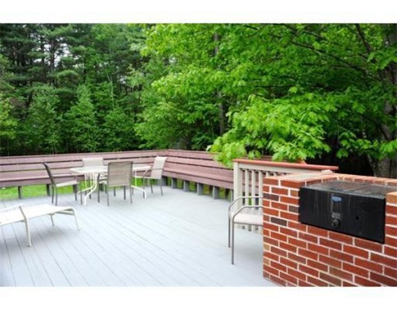 204 Fitchburg Road Townsend, MA 01469 - Photo 27 of 29 a balcony with wooden floor and outdoor seating