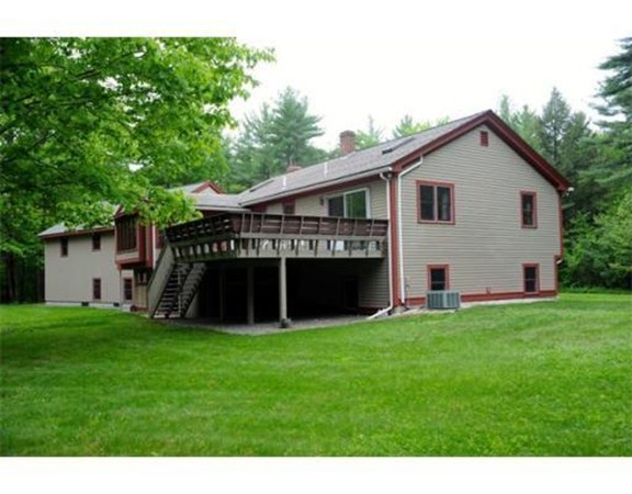 204 Fitchburg Road Townsend, MA 01469 - Photo 29 of 29 a view of a house with a yard and deck