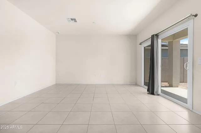 an empty room with sliding door