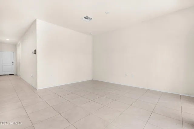 an empty room with white walls