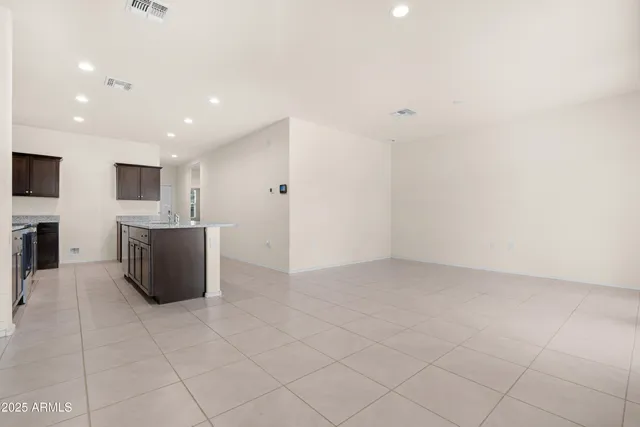 a kitchen with stainless steel appliances a sink and a refrigerator
