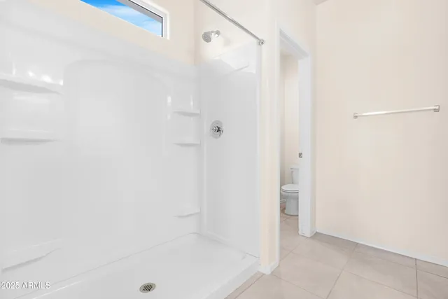 a bathroom with a shower and a tub