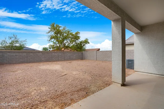 an aerial view of residential houses with outdoor space and ocean view
