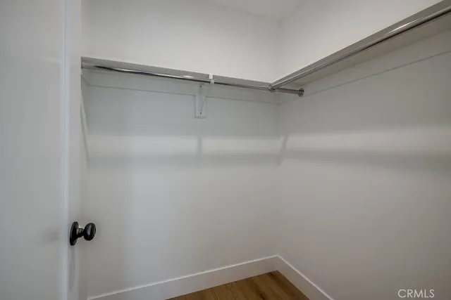 a view of a room with shelf on the wall