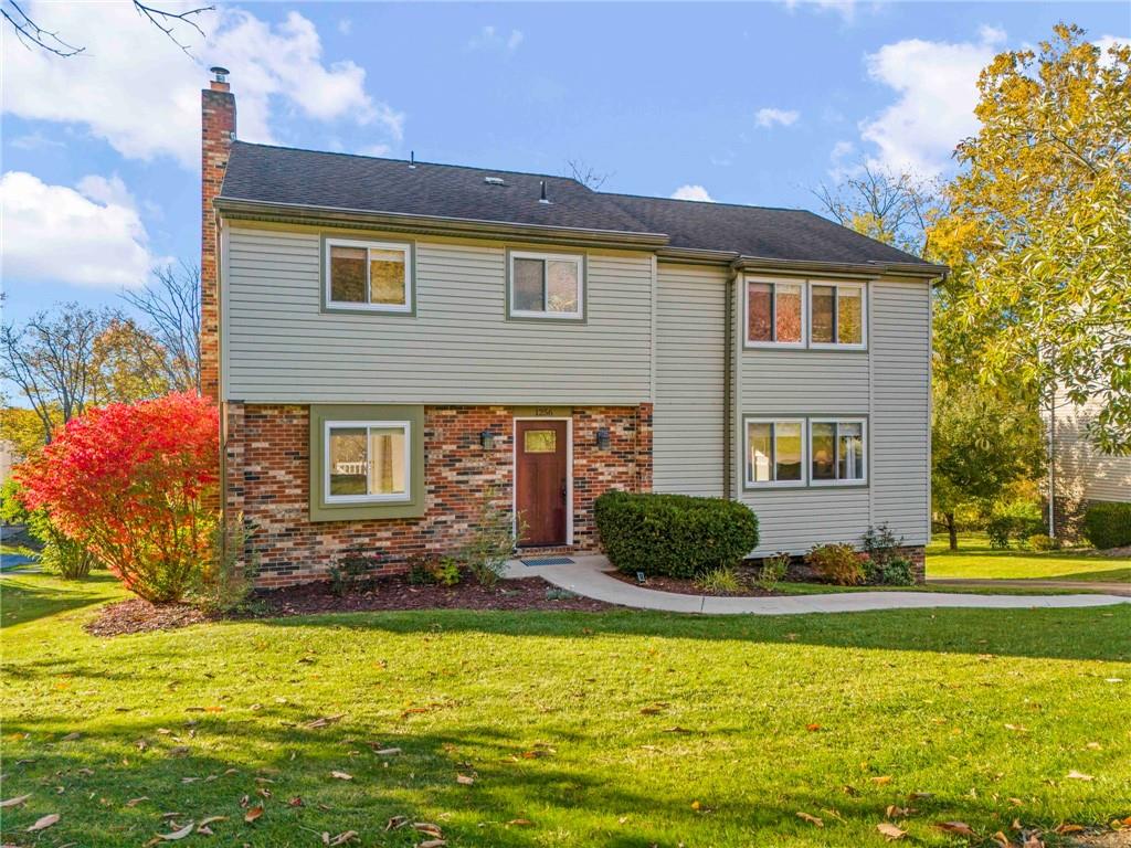 1256 Manor Drive Pittsburgh, PA 15241 - Photo 1 of 35 a front view of a house with a yard