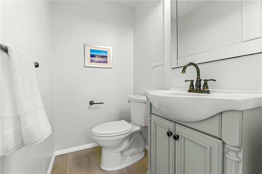 1256 Manor Drive Pittsburgh, PA 15241 - Photo 15 of 35 a bathroom with a sink toilet and a mirror