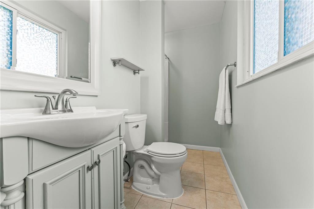 1256 Manor Drive Pittsburgh, PA 15241 - Photo 17 of 35 a bathroom with a sink toilet and window