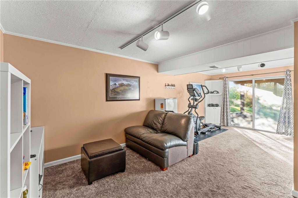 1256 Manor Drive Pittsburgh, PA 15241 - Photo 22 of 35 a living room with furniture and a large window