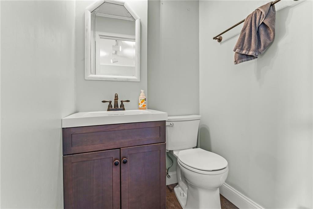 1256 Manor Drive Pittsburgh, PA 15241 - Photo 24 of 35 a bathroom with a sink a toilet and mirror